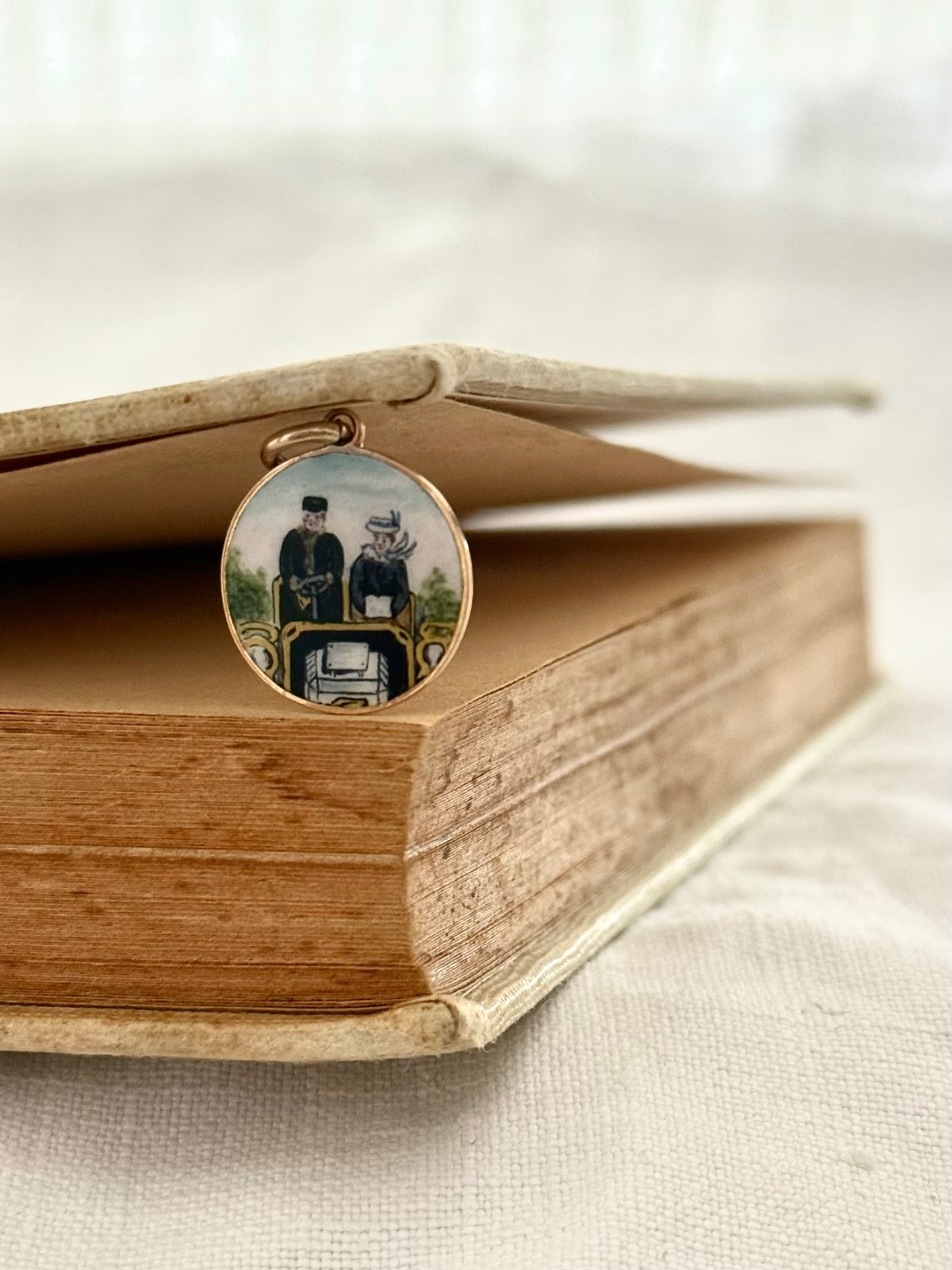 .1900s .375 .9ct gold enamel afternoon drive car drive quirky scene finely painted enamel on gold pendant