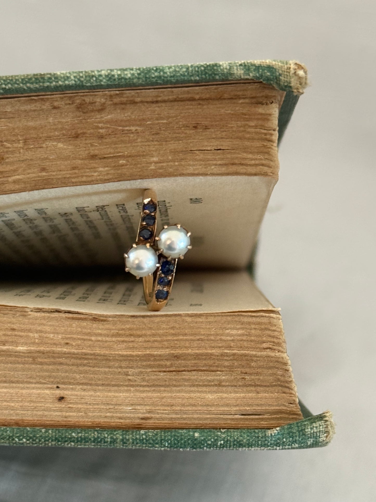 .14ct .1880s .1900s .585 gold antique Victorian Edwardian treasure Toi et Moi double pearl and sapphire bypass sweetheart commitment ring