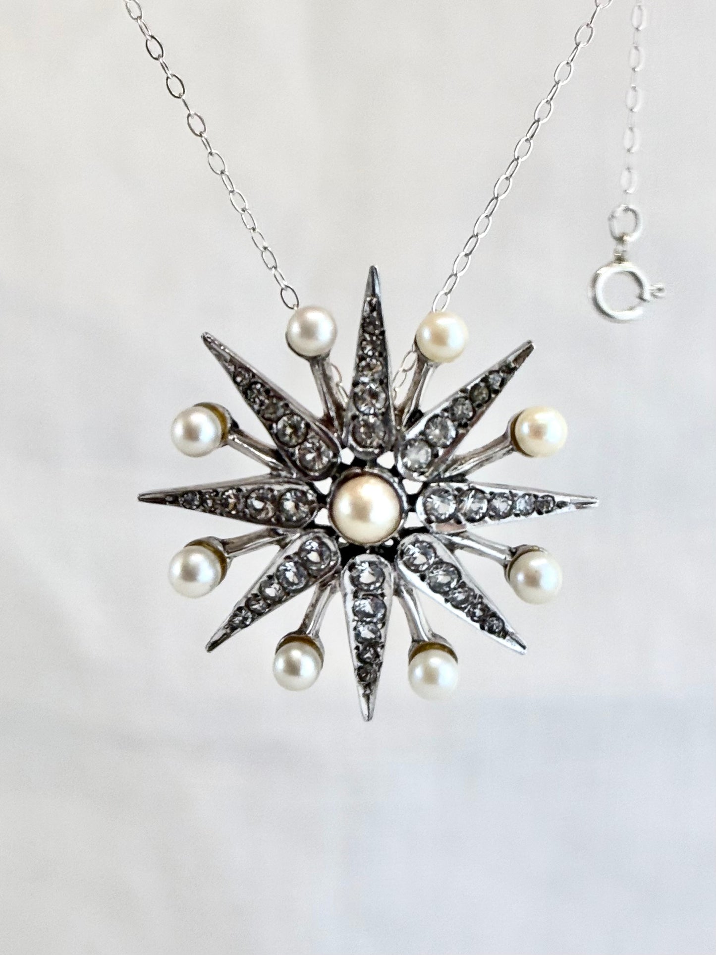 .1968 .925 Victorian revival 8 pointer sterling silver starburst star pendant with pearl and pave set diamanté gemstones
