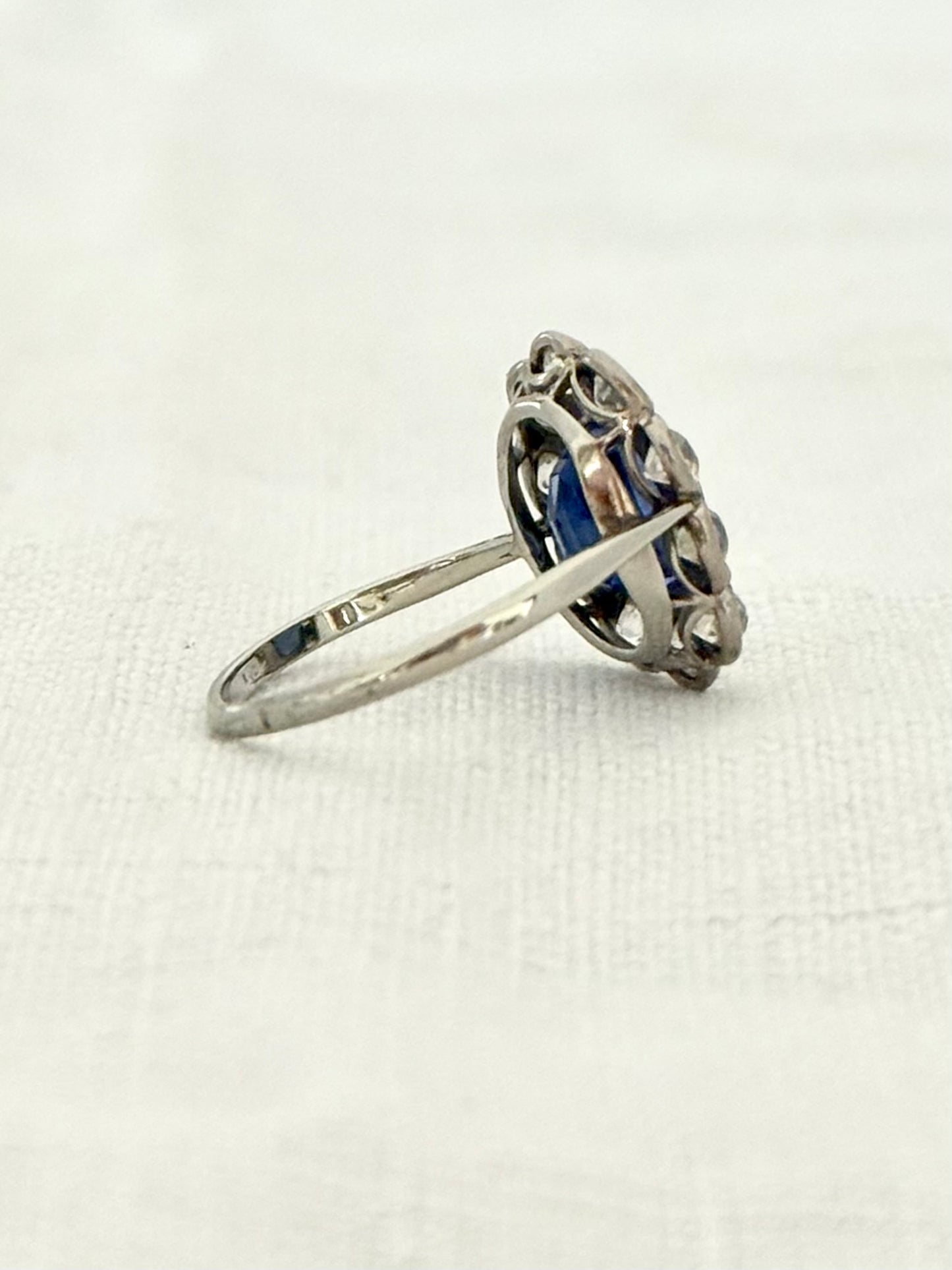 .18ct .1.20ct Old European cut diamonds and large 3.08ct Natural Sapphire era 1900s 1910s halo cluster white gold ring