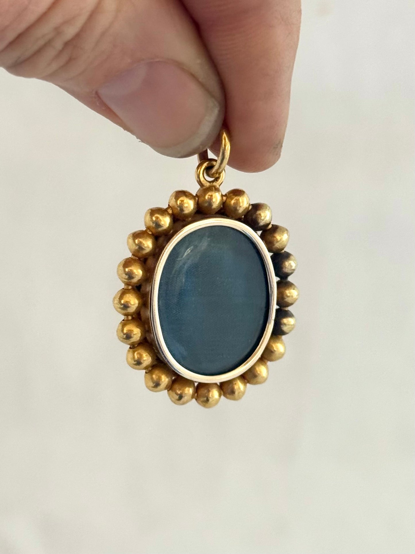 .15ct .1850s .1860s antique Victorian Yellow Gold Cushion cut Diamond Rose Cut Diamond star starburst Angel Coral and Blue Enamel Etruscan Revival Beaded border Mourning locket pendant