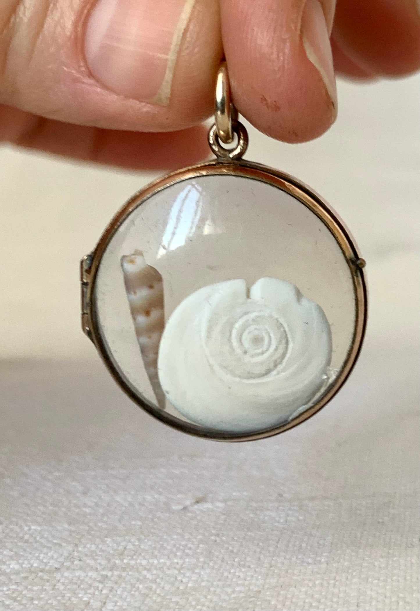 .1870s .1880s antique and very rare rock crystal Victorian solid rich gold pool of light style sought after antique orb circle memory locket.