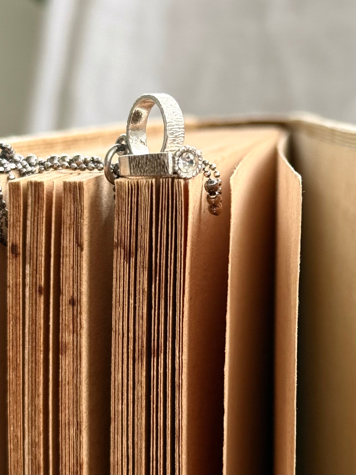 .1970s .925 Miniature wedding ring commitment ring silver retro diamanté ring token charm pendant