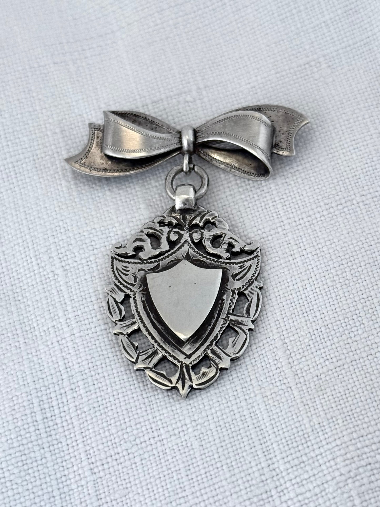 .1940s .1950s .925 Awards sterling silver Sweetheart bow and fob medallion brooch