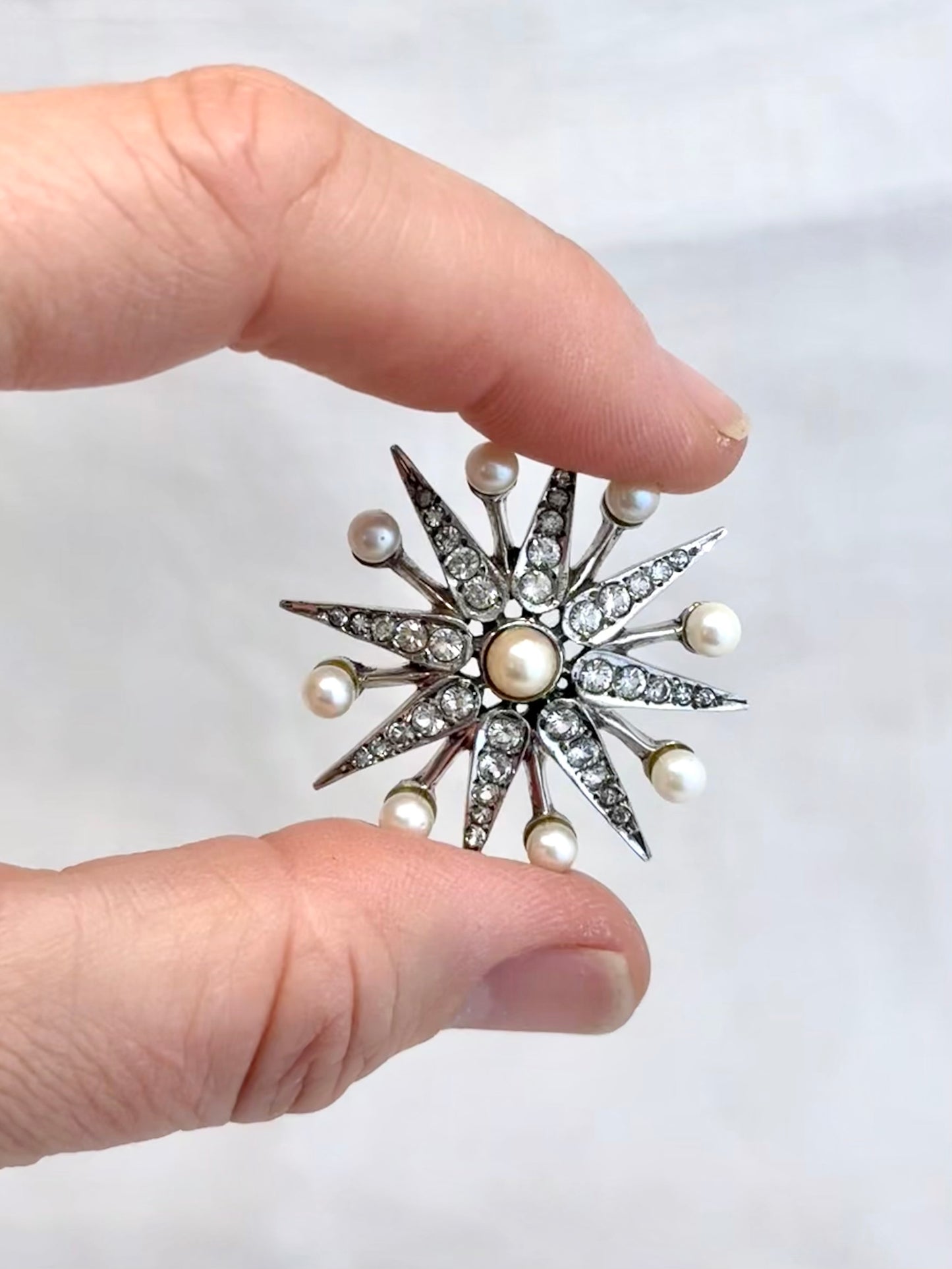 .1968 .925 Victorian revival 8 pointer sterling silver starburst star pendant with pearl and pave set diamanté gemstones
