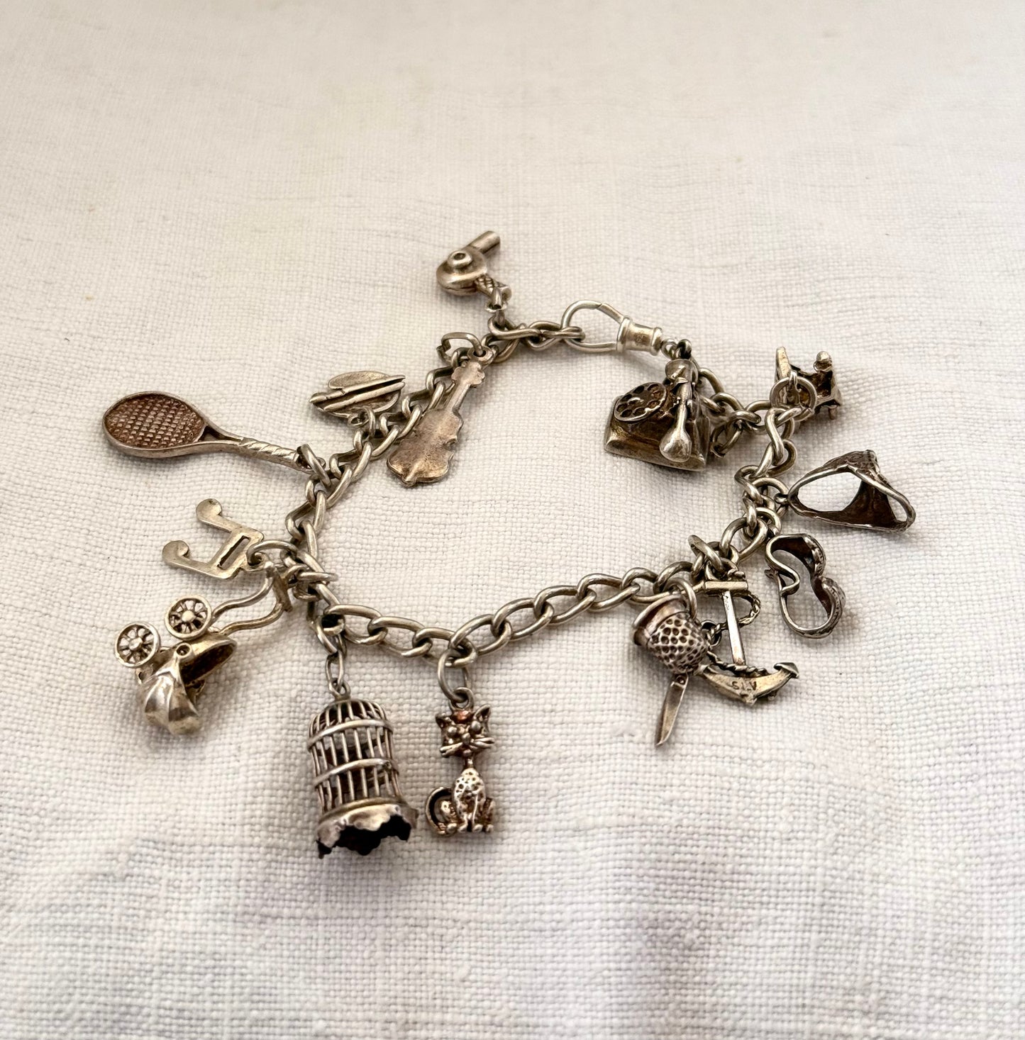 .14 charms .1970s .925 dangly keepsake charm bracelet