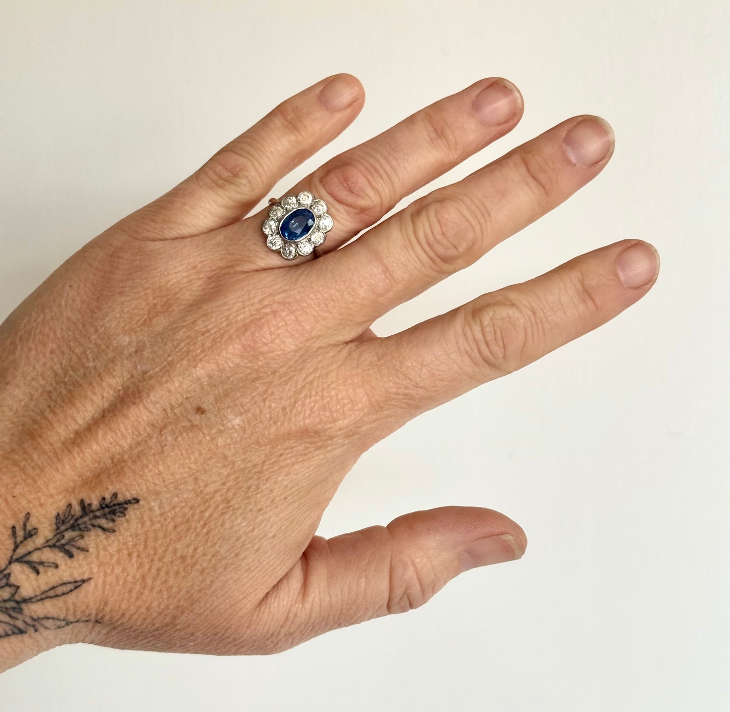 .18ct .1.20ct Old European cut diamonds and large 3.08ct Natural Sapphire era 1900s 1910s halo cluster white gold ring