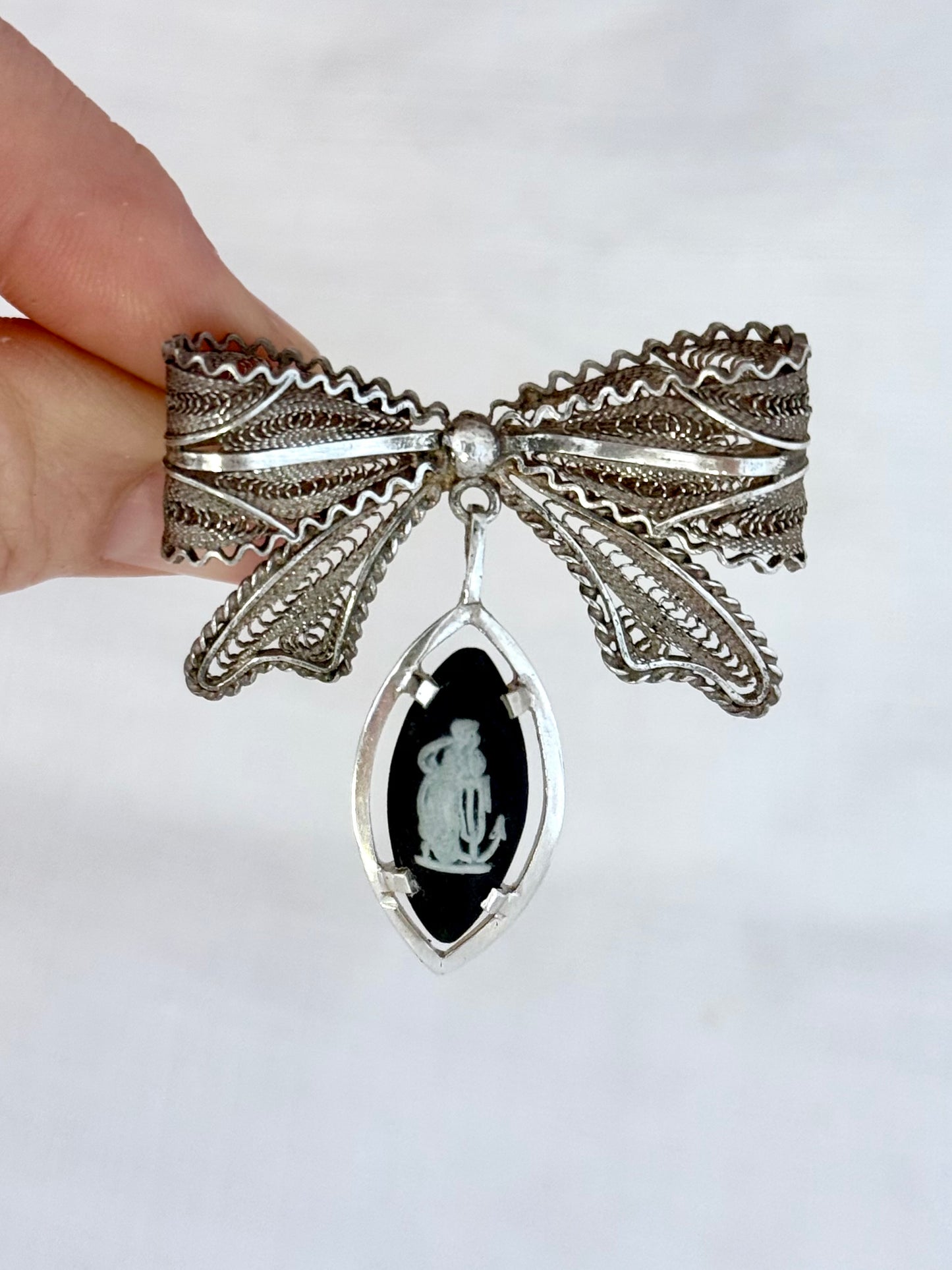 .1940s .1970s .925 artisan made fine filigree open work Malta hand made fine silver wire woven ribbon bow pin brooch with Wedgwood charcoal black vintage Jasperware high relief cameo dangle