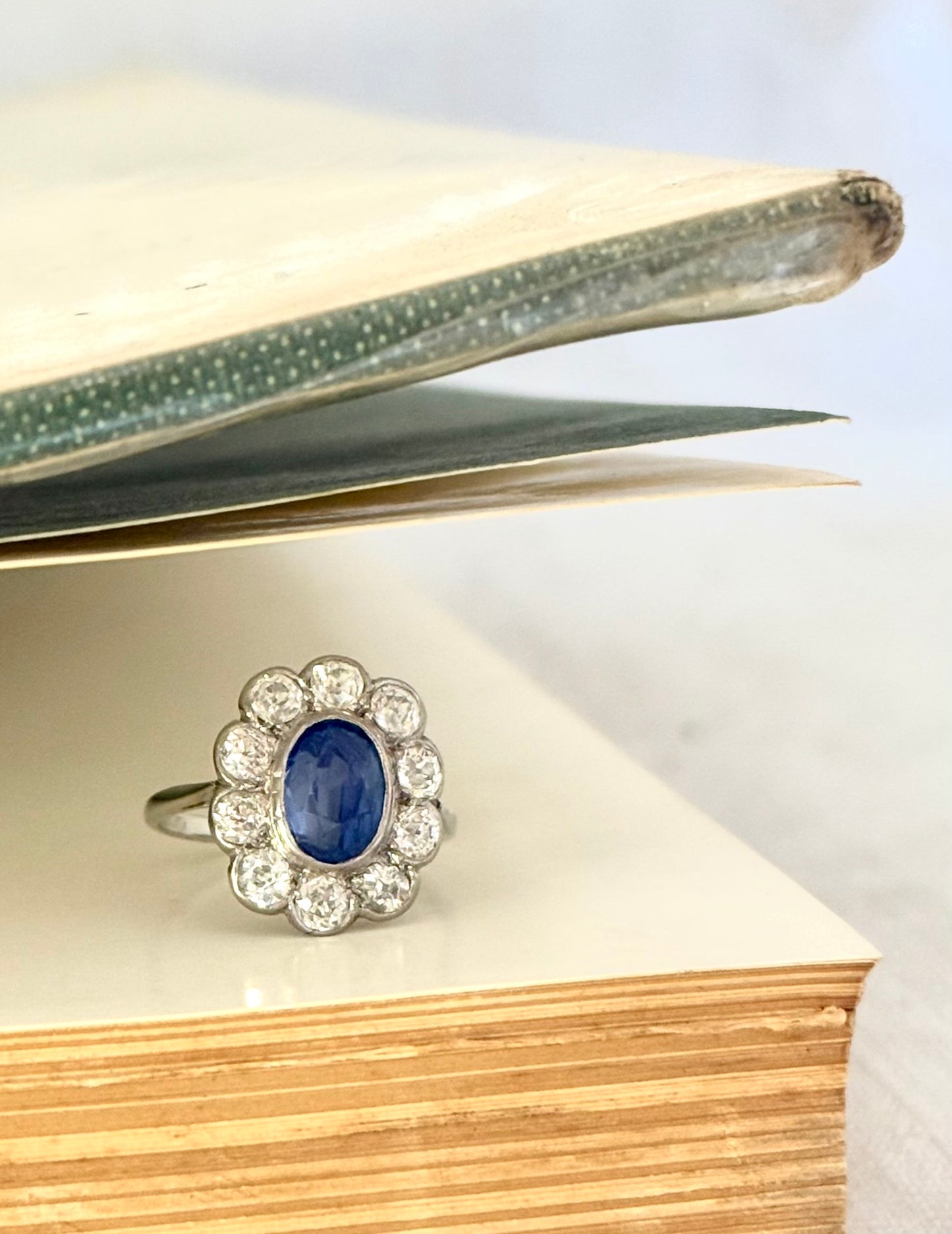 .18ct .1.20ct Old European cut diamonds and large 3.08ct Natural Sapphire era 1900s 1910s halo cluster white gold ring