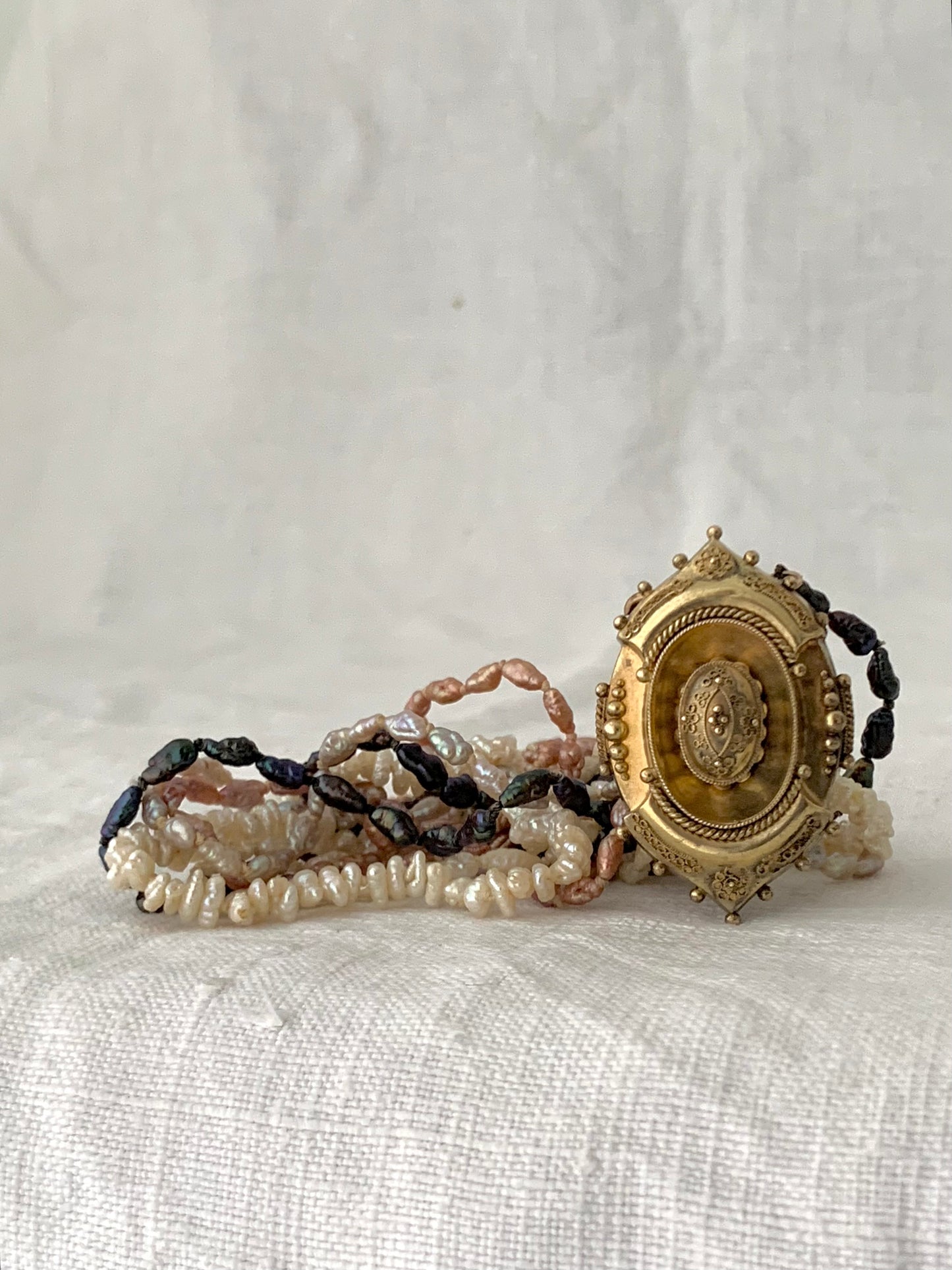 1800s 9ct gold Antique Etruscan revival Victorian yellow gold high detailed ornate oval pendant on dreamy shell coloured multi string 5 x string fresh water rice pearl necklace