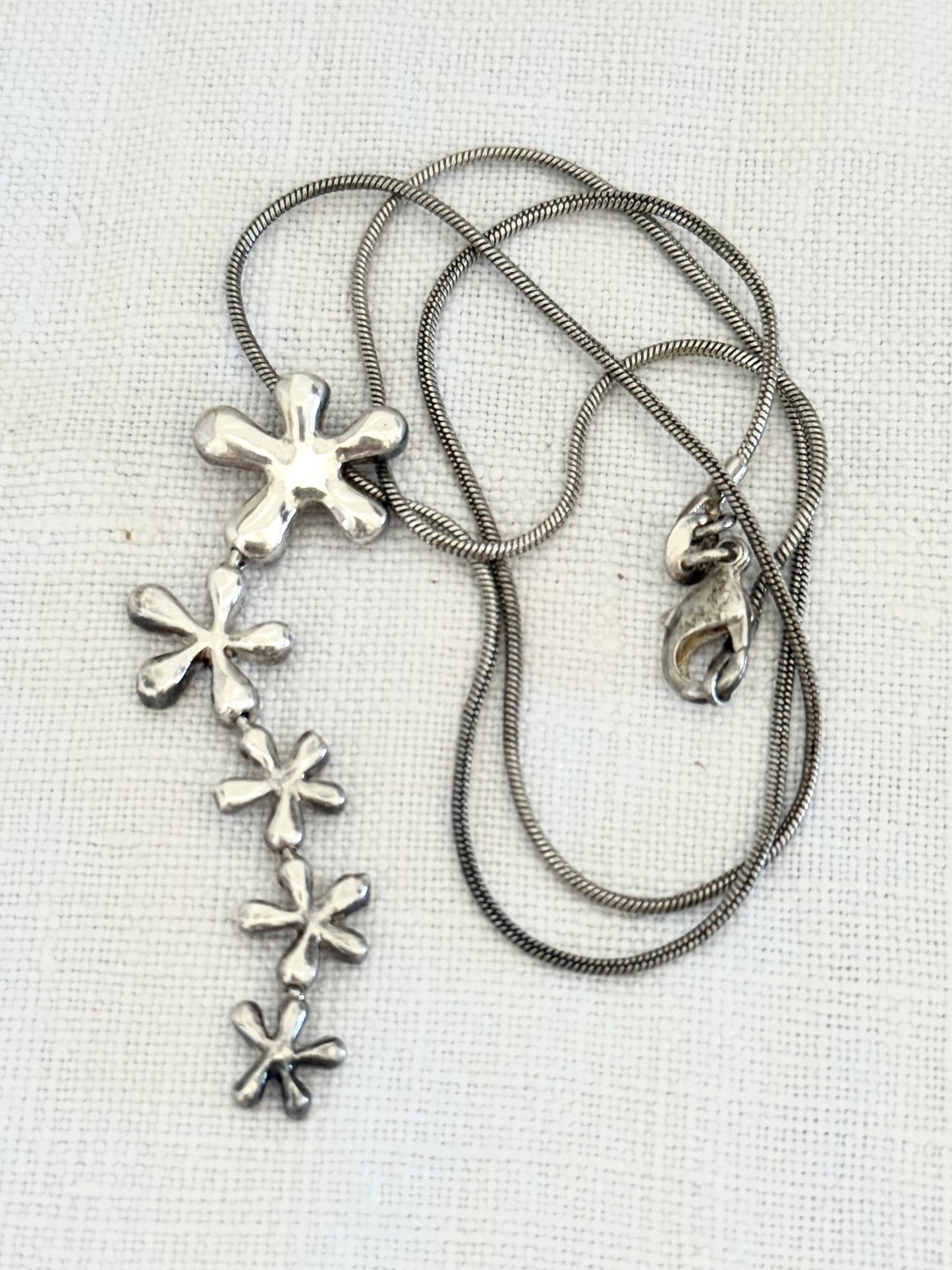 .925 .1950s revival modernist sterling silver floral waterfall drop pendant silver snake chain