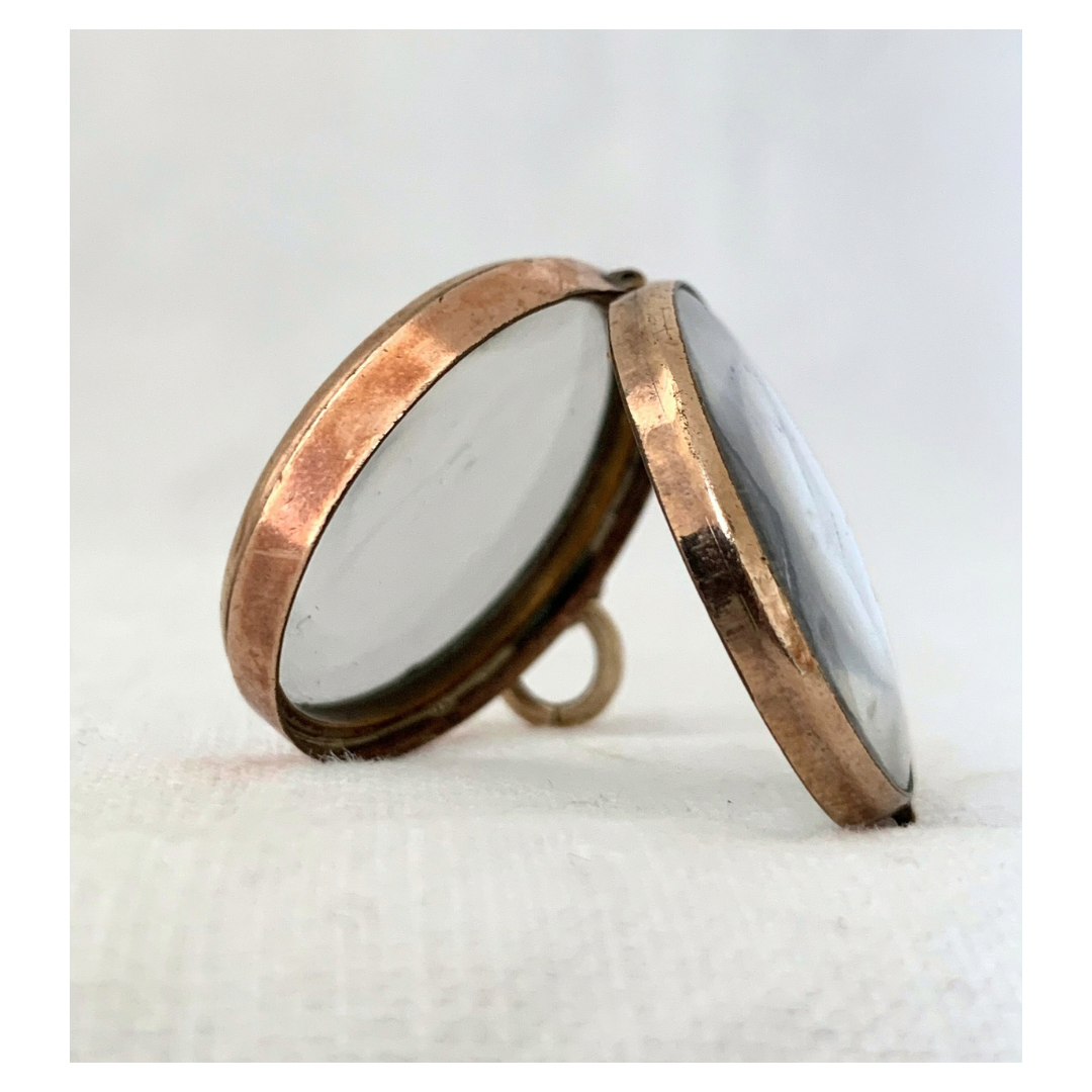 .1870s .1880s antique and very rare rock crystal Victorian solid rich gold pool of light style sought after antique orb circle memory locket.