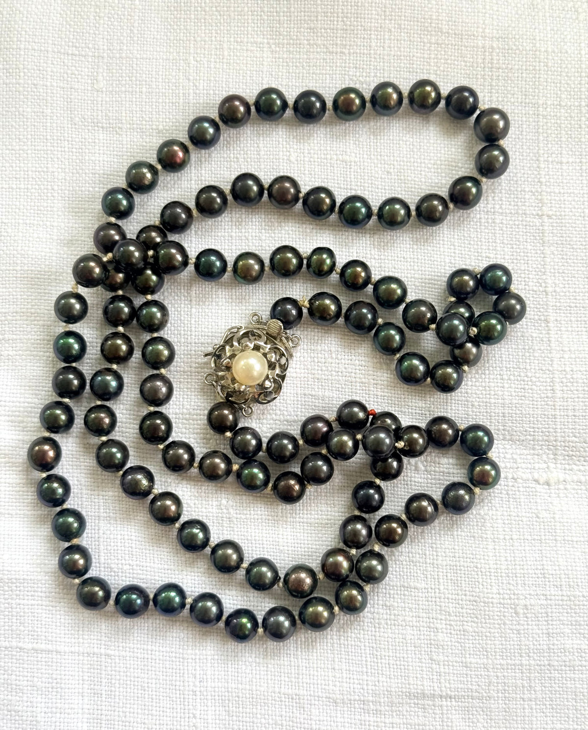 .925 .77.5cm long luxury cultured pearl real Tahitian purple petrol brown knotted Pearl necklace with floral sterling silver box clasp