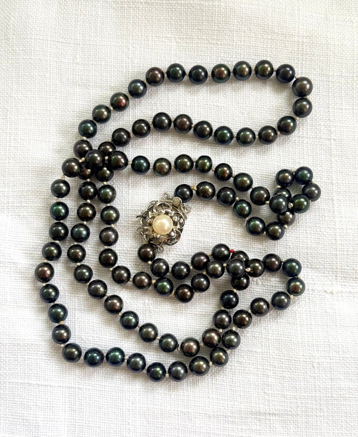 .925 .77.5cm long luxury cultured pearl real Tahitian purple petrol brown knotted Pearl necklace with floral sterling silver box clasp