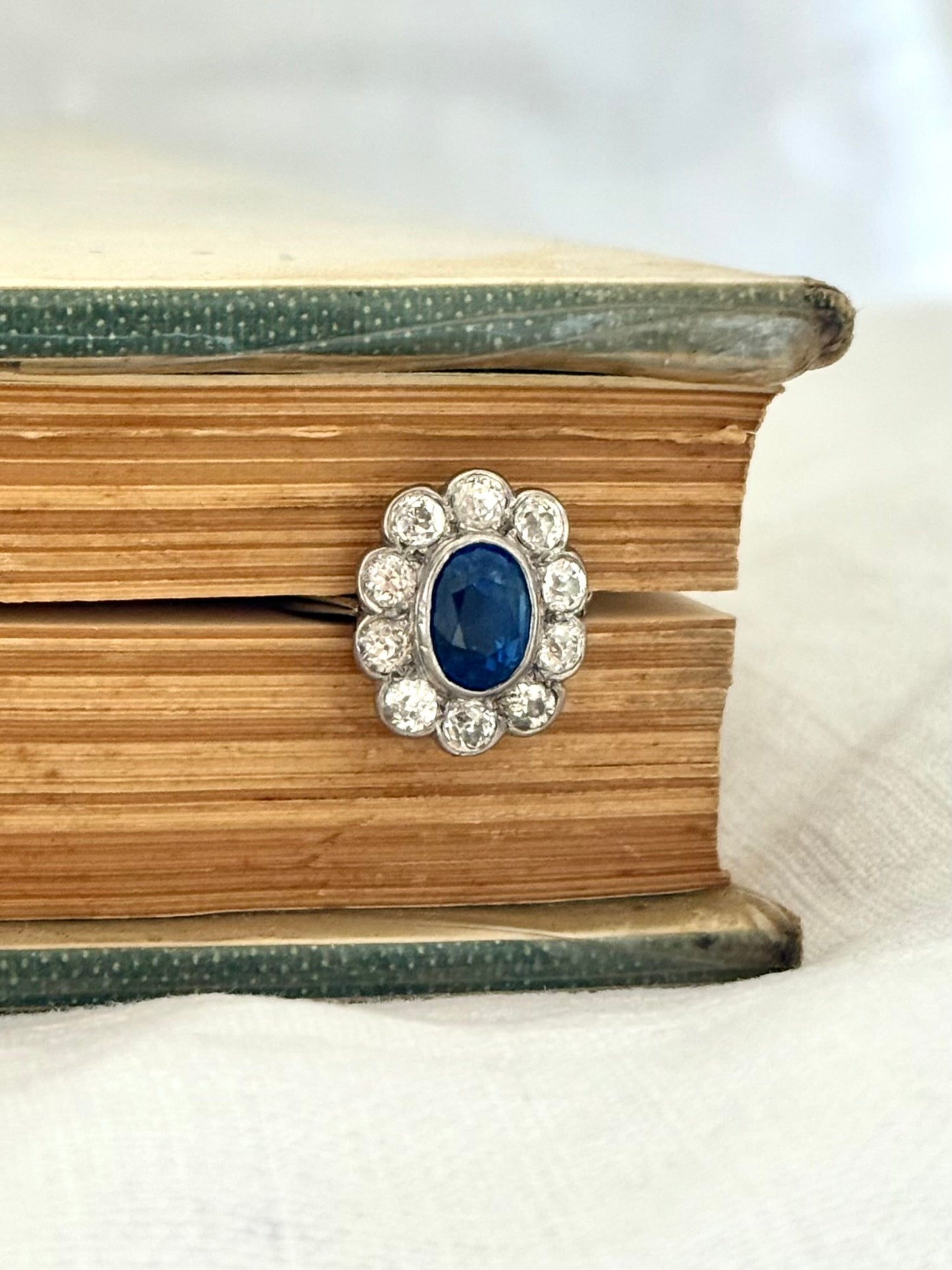 .18ct .1.20ct Old European cut diamonds and large 3.08ct Natural Sapphire era 1900s 1910s halo cluster white gold ring