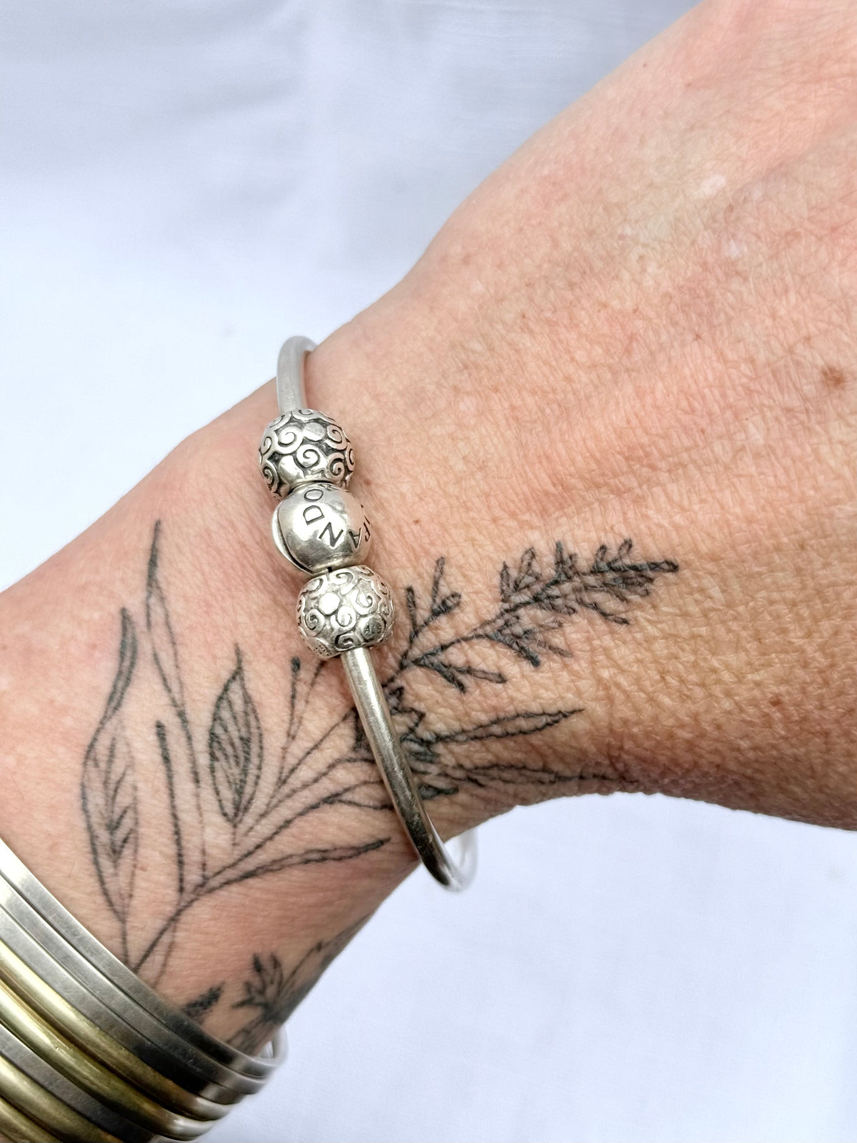 .925 signed Pandora Moments classic sterling silver ball clasp bangle with two screw on filigree form ball charms