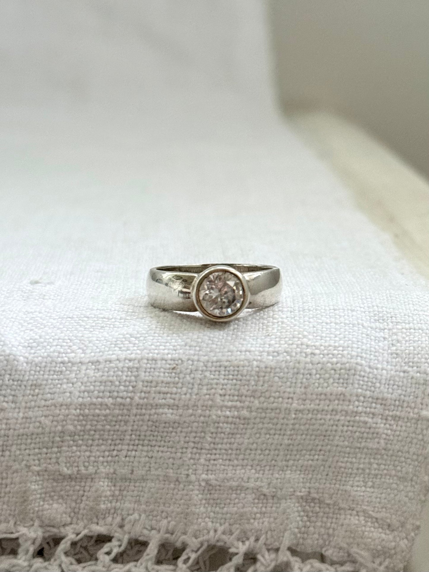 .925 classic large solitaire clear gemstone in wide set bezel set silver engagement style ring