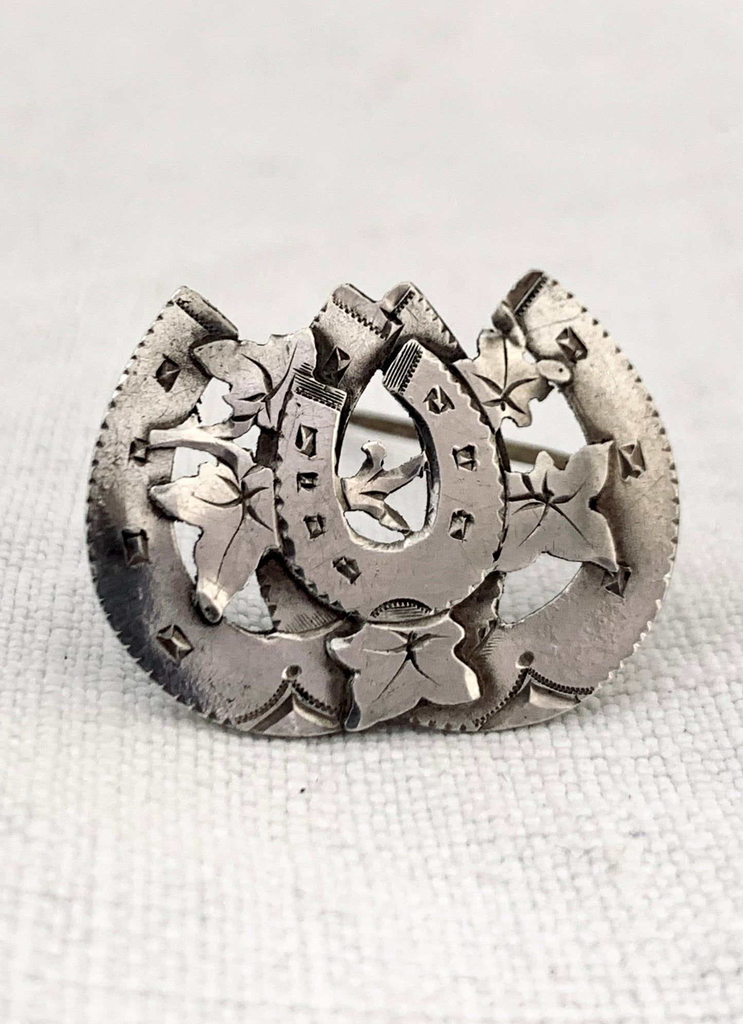 circa 1891 Victorian sentimental triple three horse shoe Aesthetic movement hallmarked hallmark sterling silver brooch.