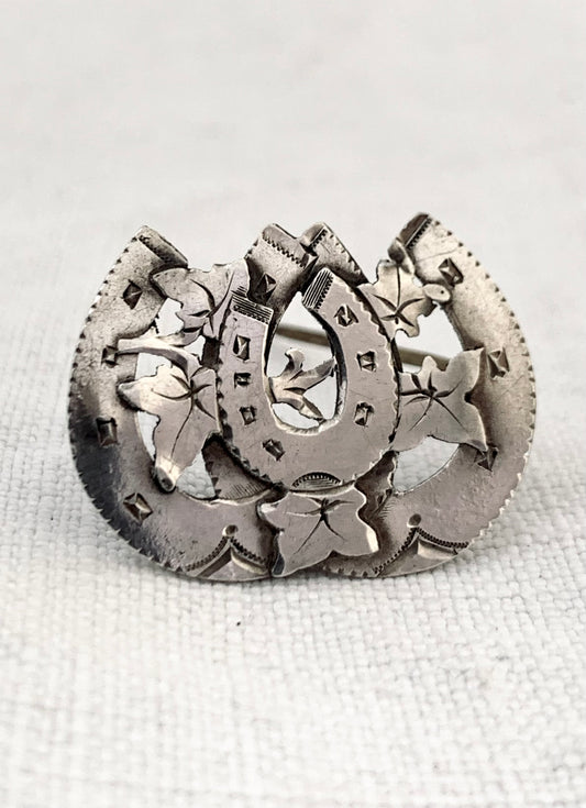 circa 1891 Victorian sentimental triple three horse shoe Aesthetic movement hallmarked hallmark sterling silver brooch.