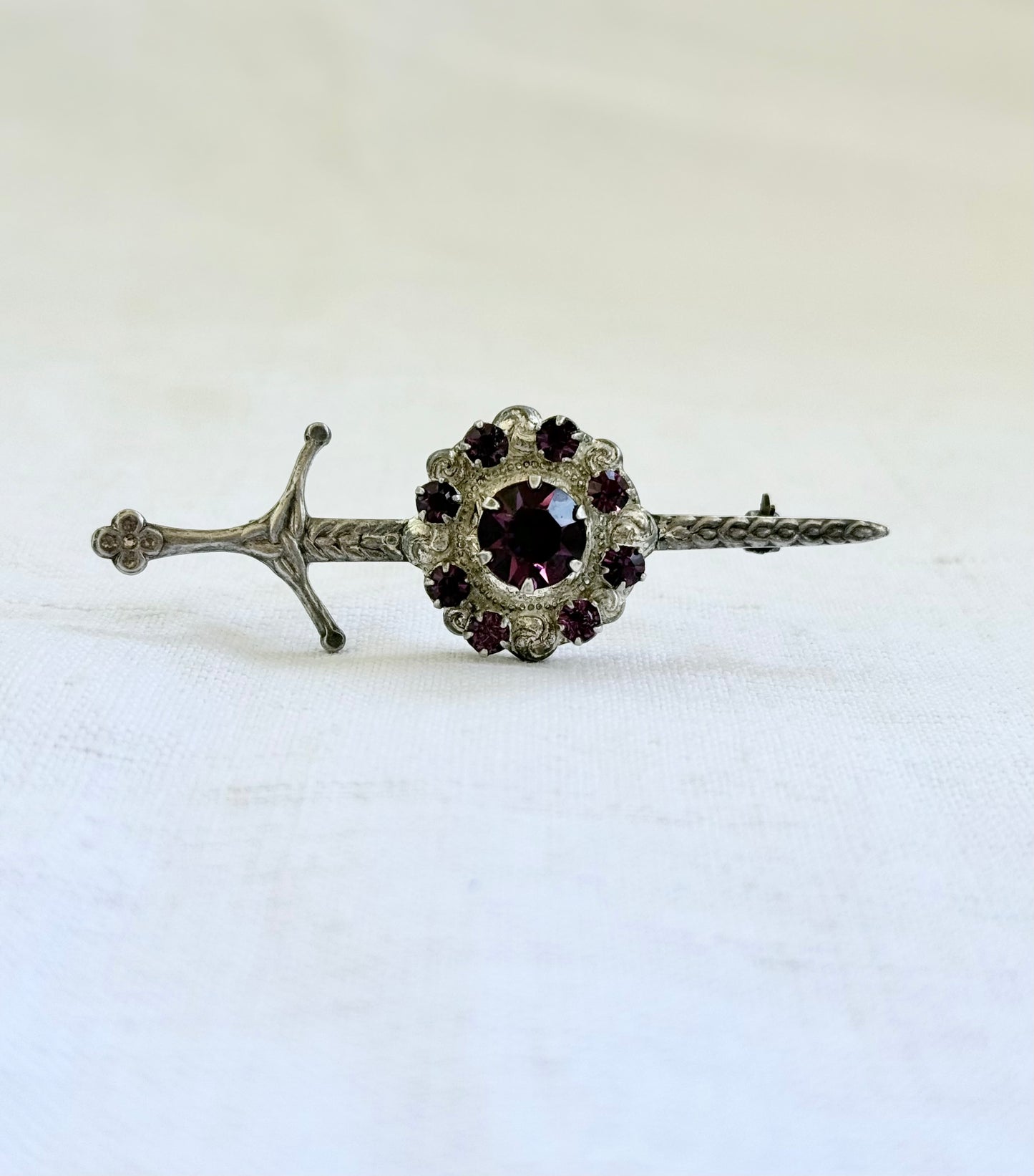.1920s .1930s .925 Scottish silver Amethyst paste sword and shield brooch.
