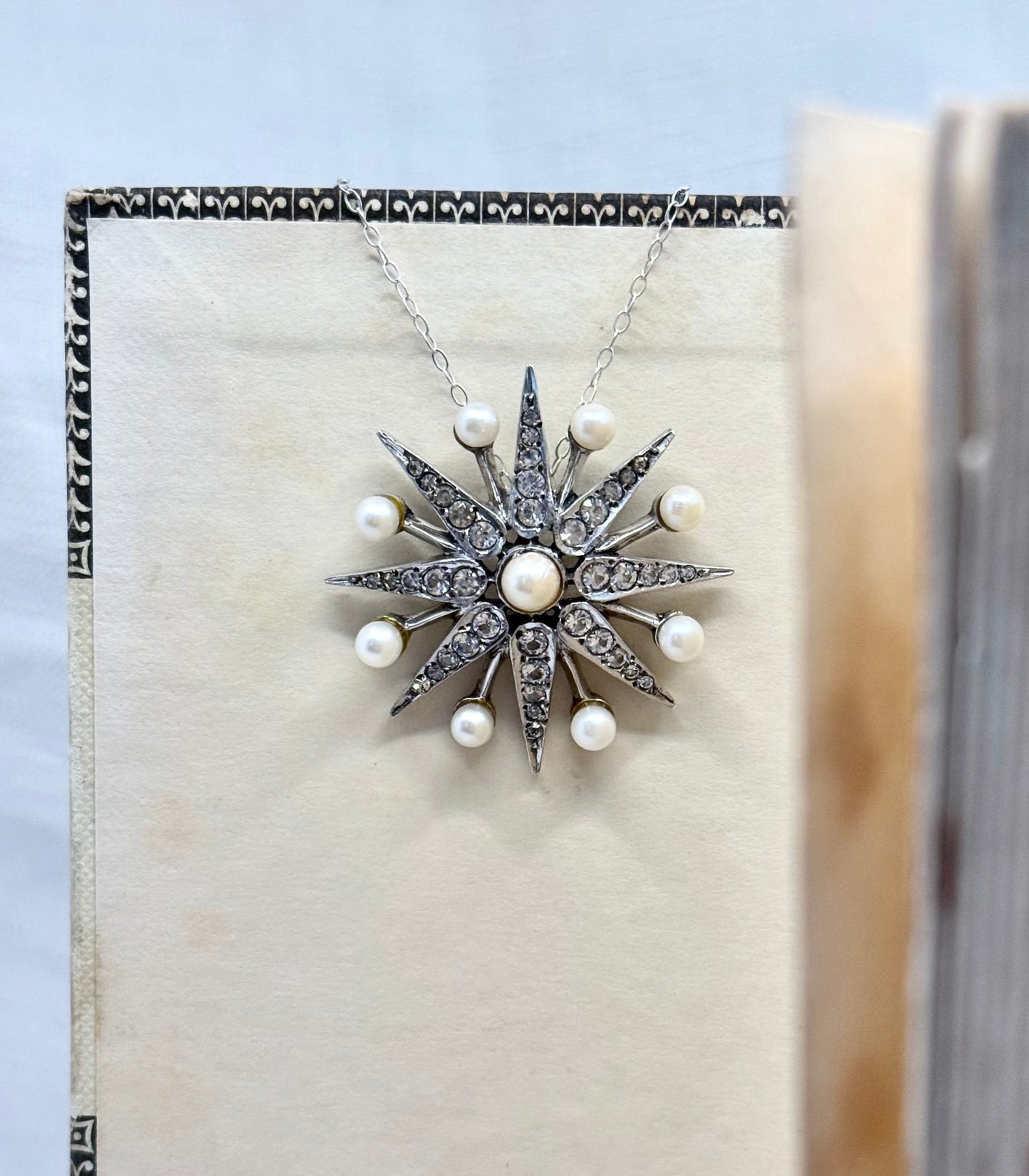 .1968 .925 Victorian revival 8 pointer sterling silver starburst star pendant with pearl and pave set diamanté gemstones