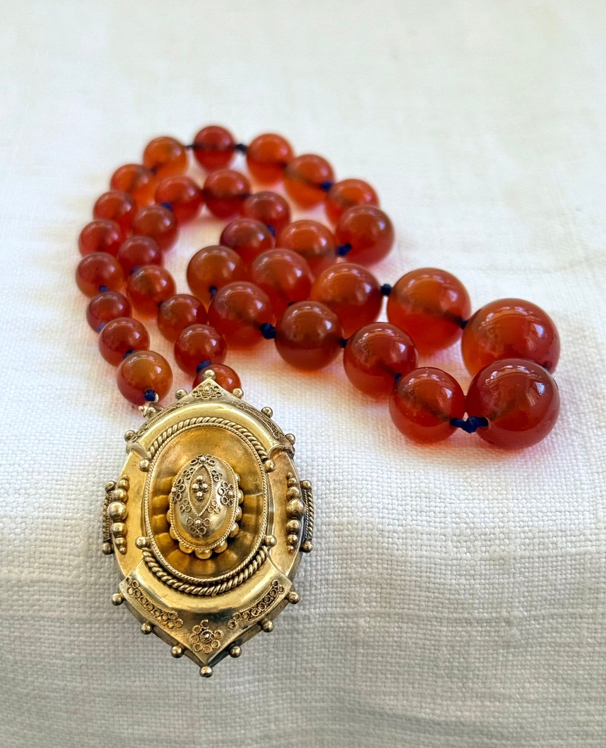 .1800s .375 .9ct gold Antique decorative fine Etruscan revival Victorian ornate gold oval pendant on luxury Carnelian bead graduated gemstone necklace setting