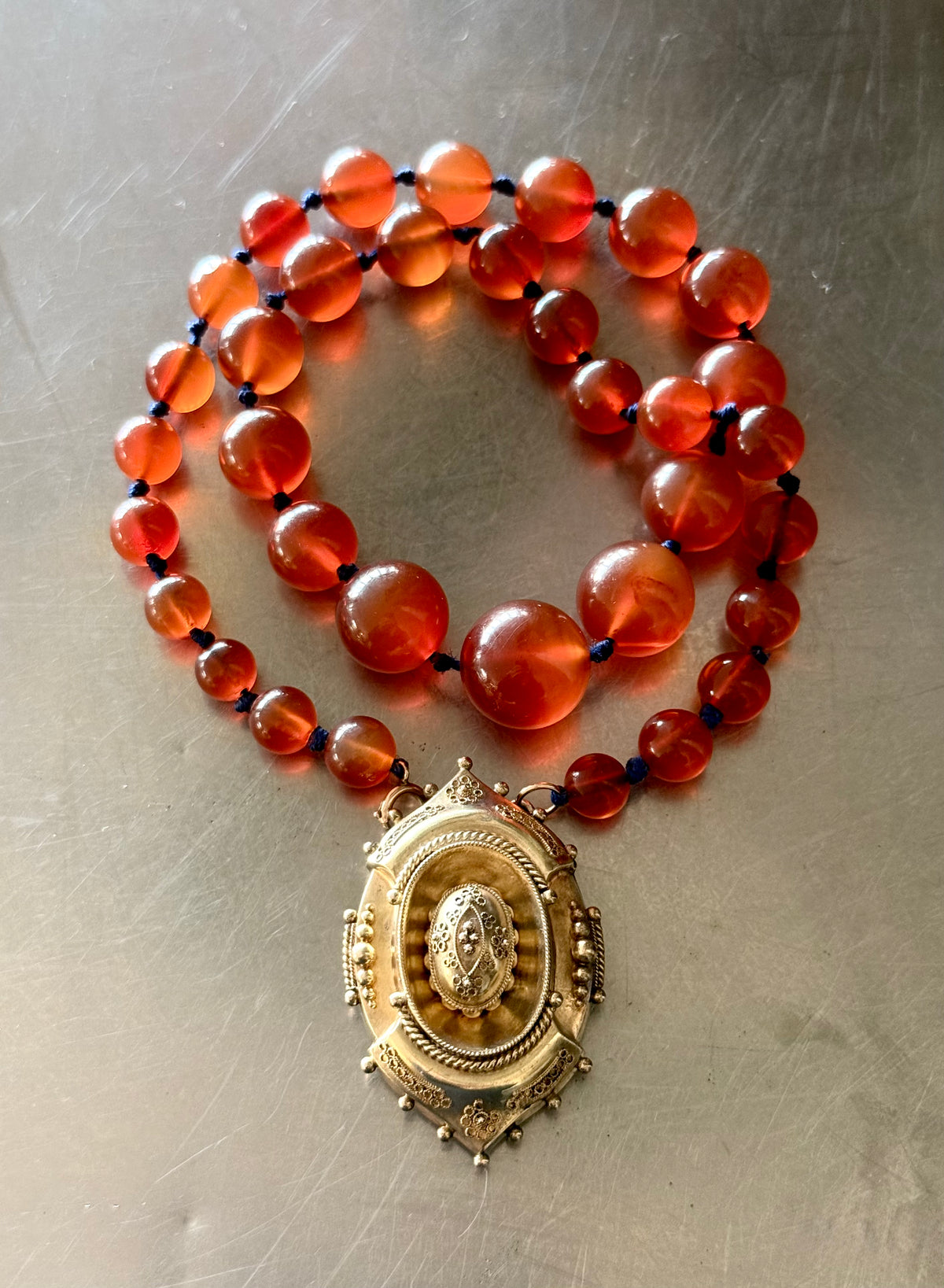 .1800s .375 .9ct gold Antique decorative fine Etruscan revival Victorian ornate gold oval pendant on luxury Carnelian bead graduated gemstone necklace setting