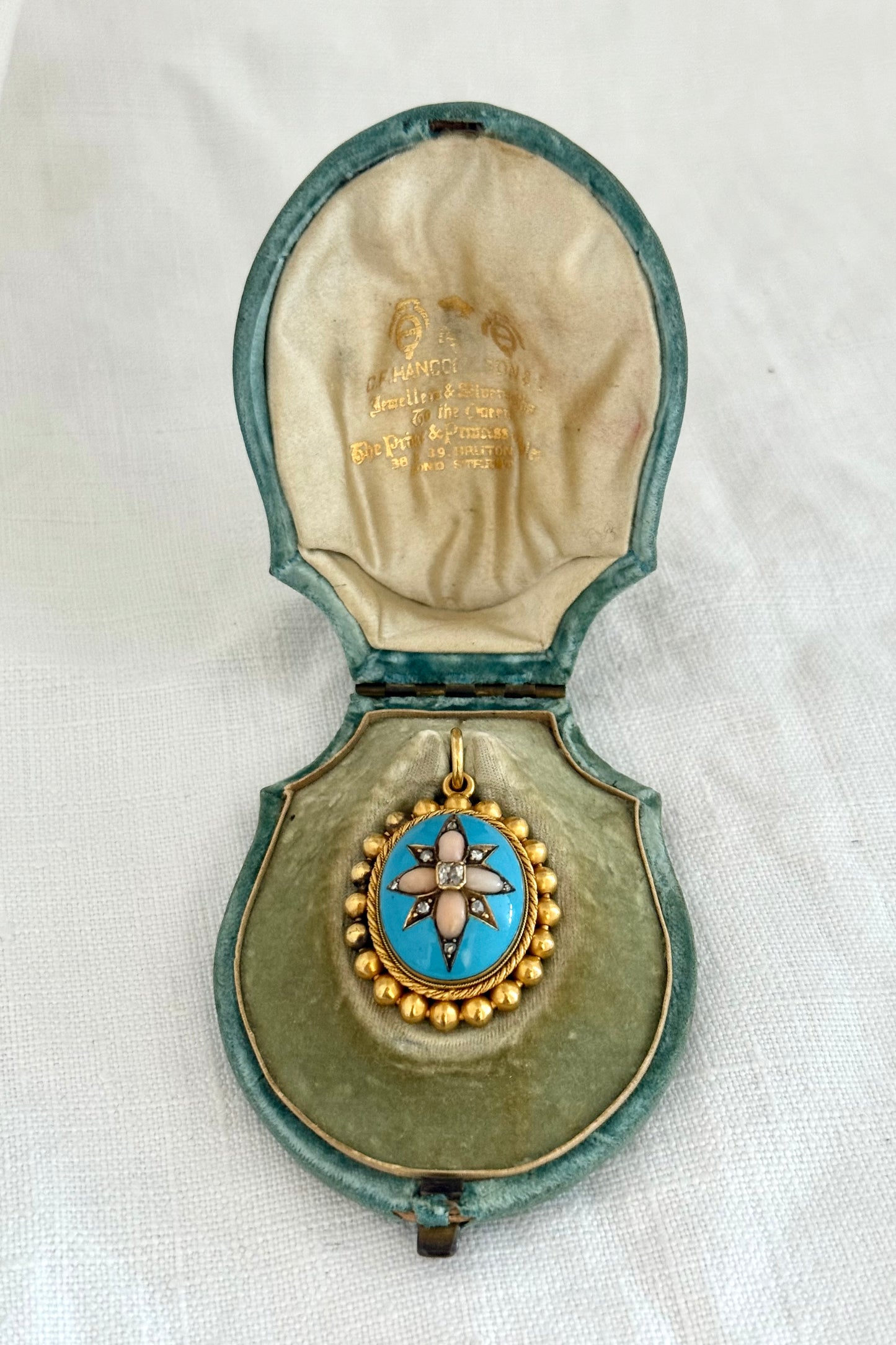 .15ct .1850s .1860s antique Victorian Yellow Gold Cushion cut Diamond Rose Cut Diamond star starburst Angel Coral and Blue Enamel Etruscan Revival Beaded border Mourning locket pendant