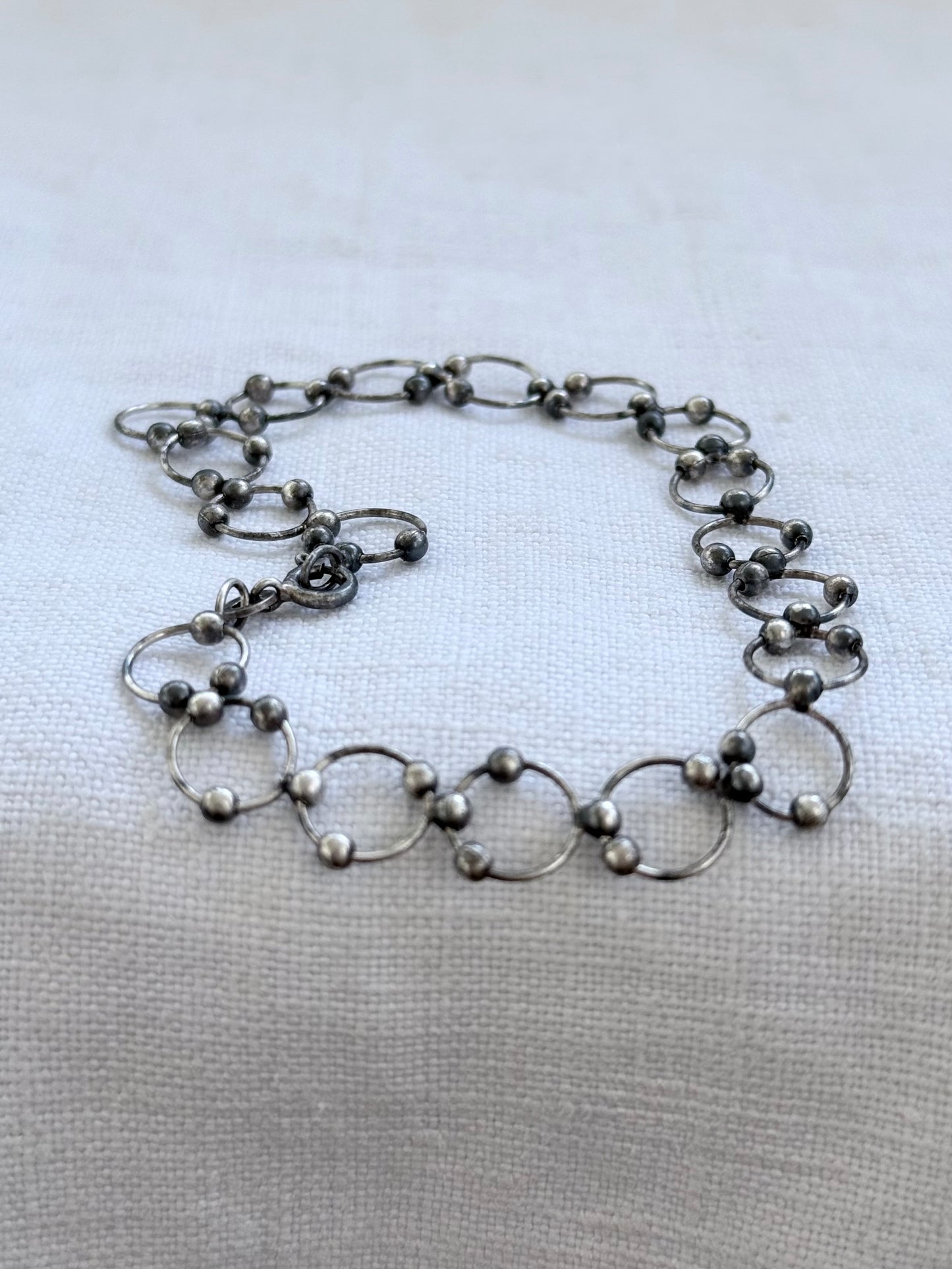 .21cm .925 articulated circular circle modernist silver link chain bracelet
