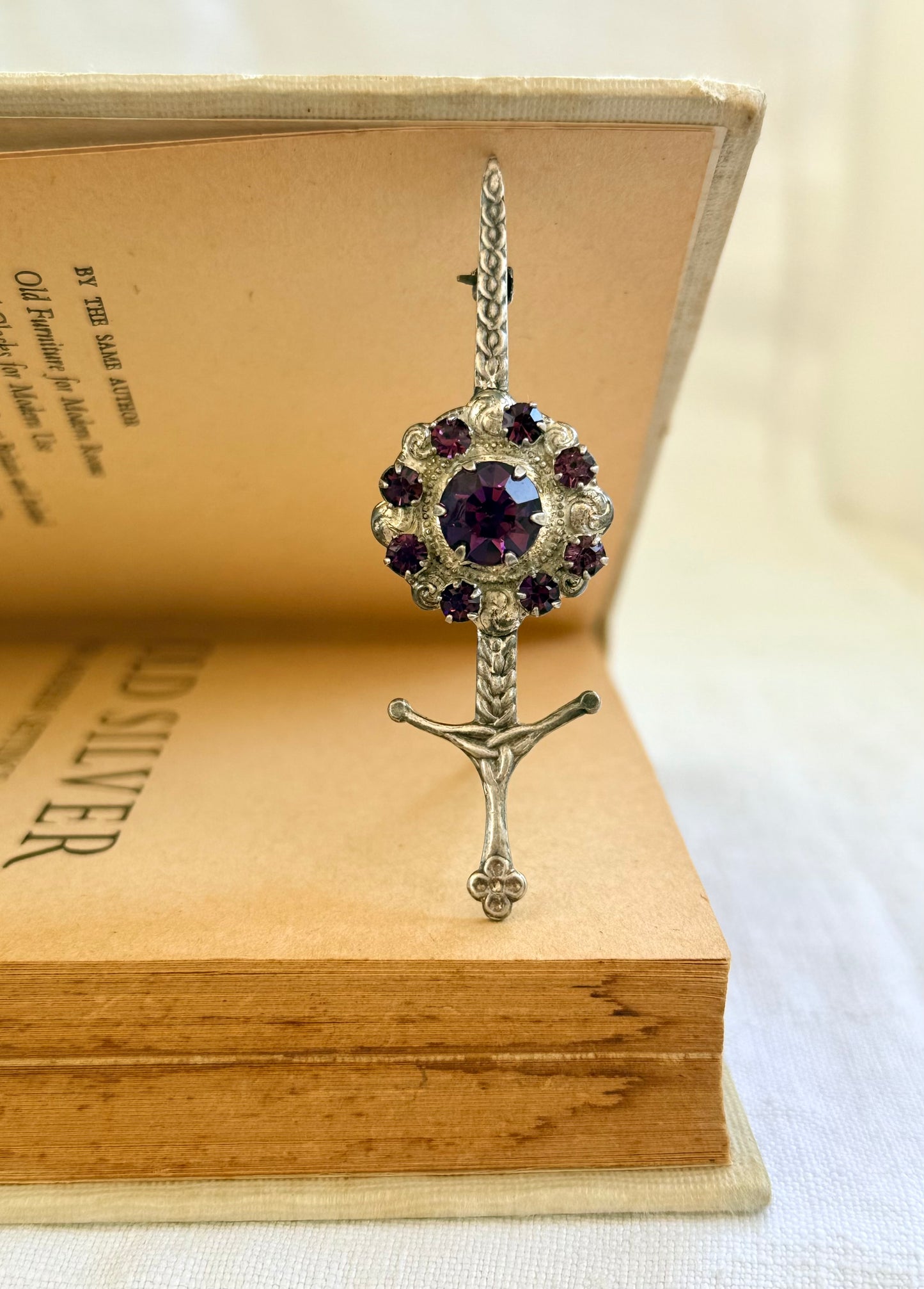 .1920s .1930s .925 Scottish silver Amethyst paste sword and shield brooch.