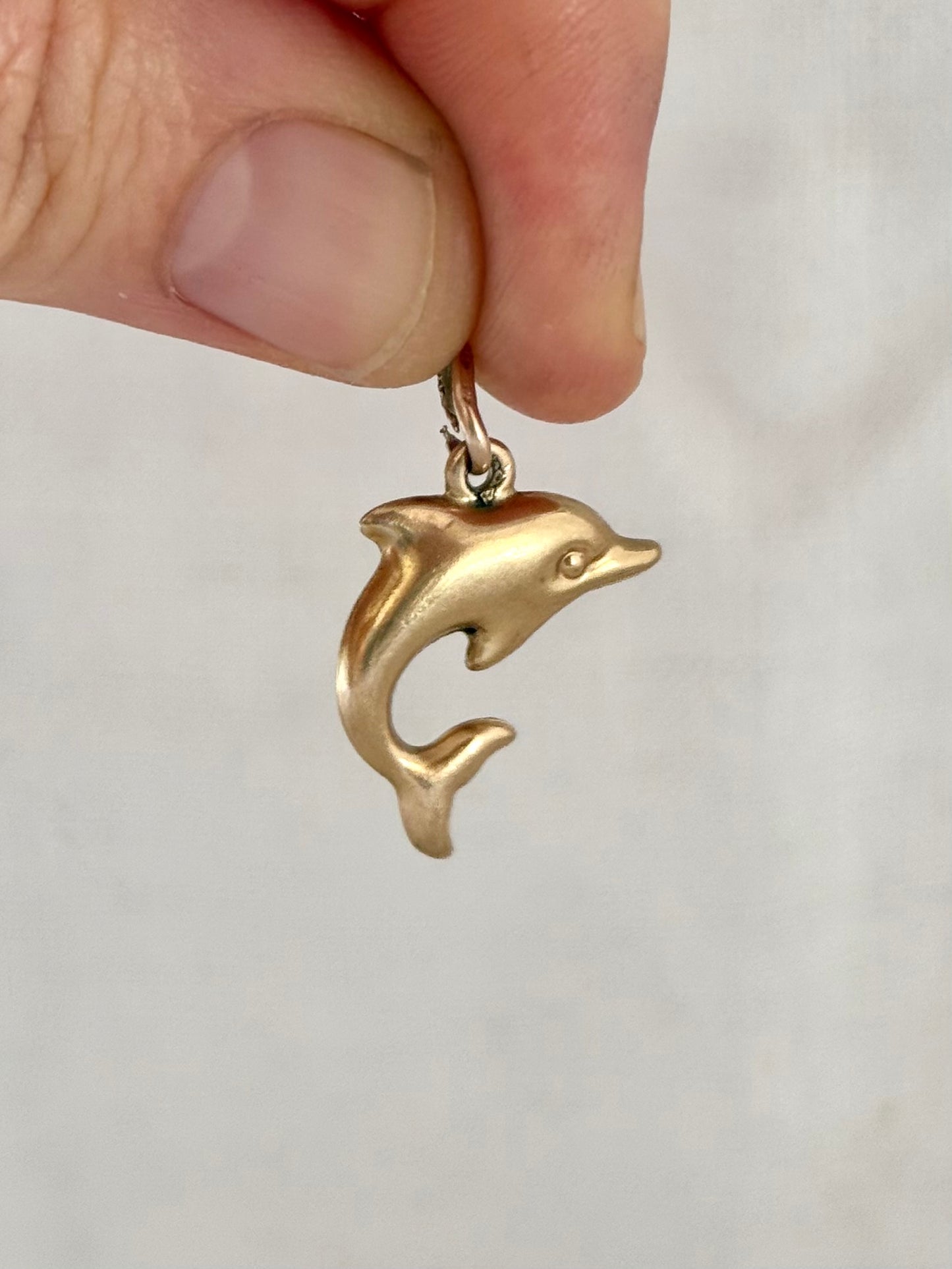 .1970s .375 .9ct well sized yellow gold dolphin charm pendant