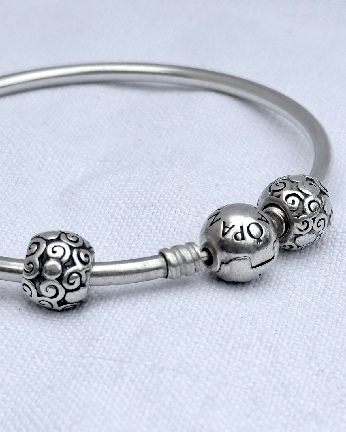 .925 signed Pandora Moments classic sterling silver ball clasp bangle with two screw on filigree form ball charms