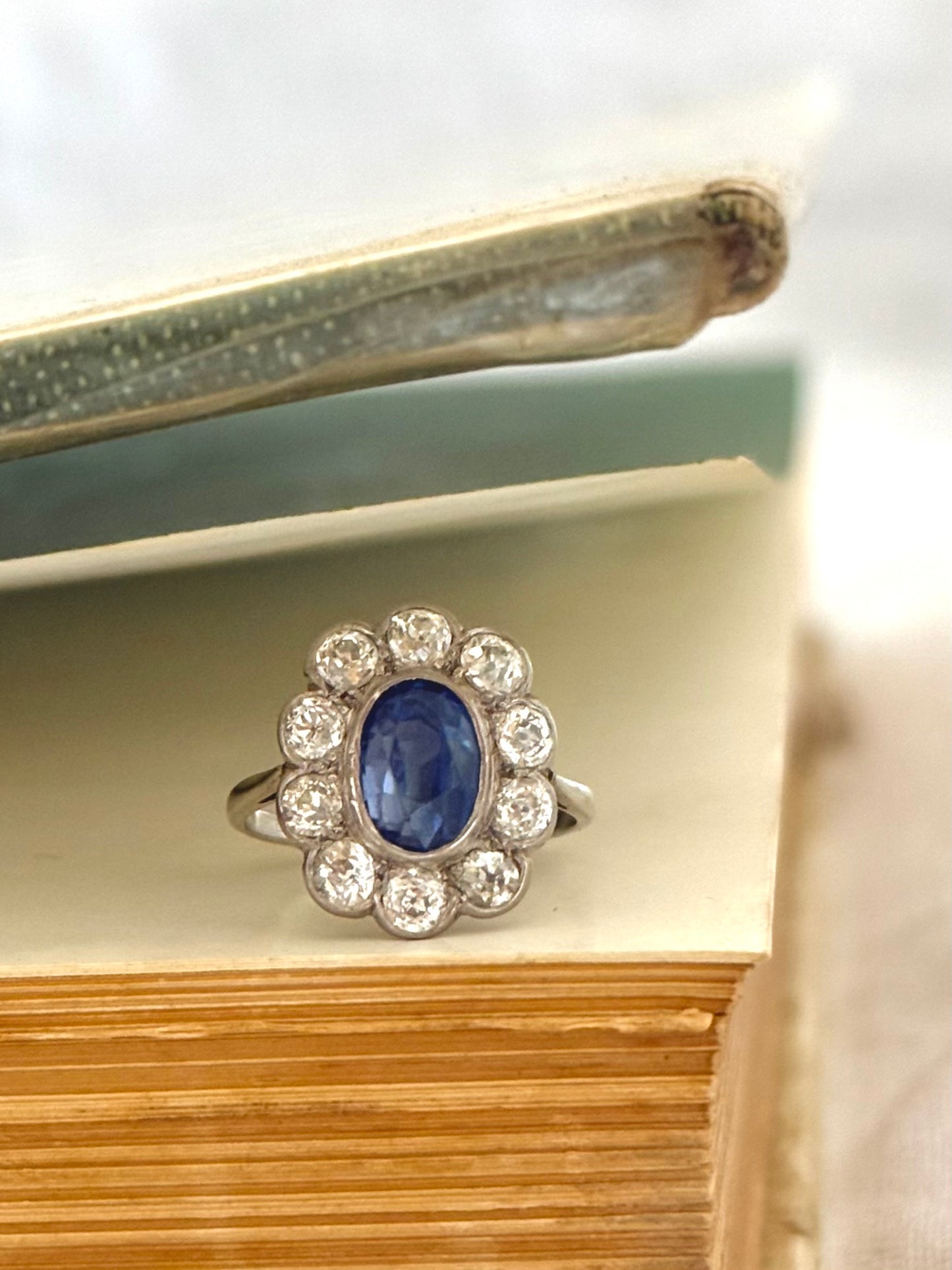 .18ct .1.20ct Old European cut diamonds and large 3.08ct Natural Sapphire era 1900s 1910s halo cluster white gold ring