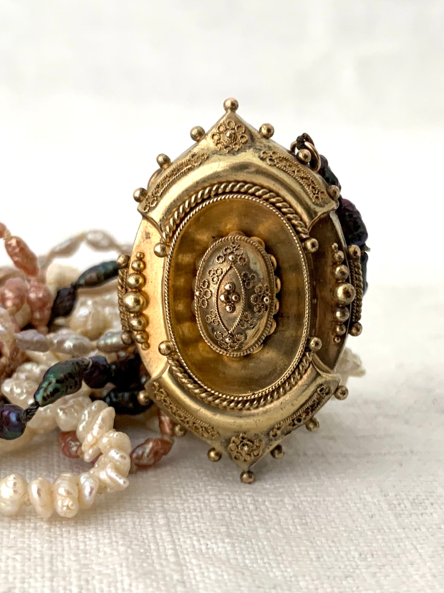 1800s 9ct gold Antique Etruscan revival Victorian yellow gold high detailed ornate oval pendant on dreamy shell coloured multi string 5 x string fresh water rice pearl necklace
