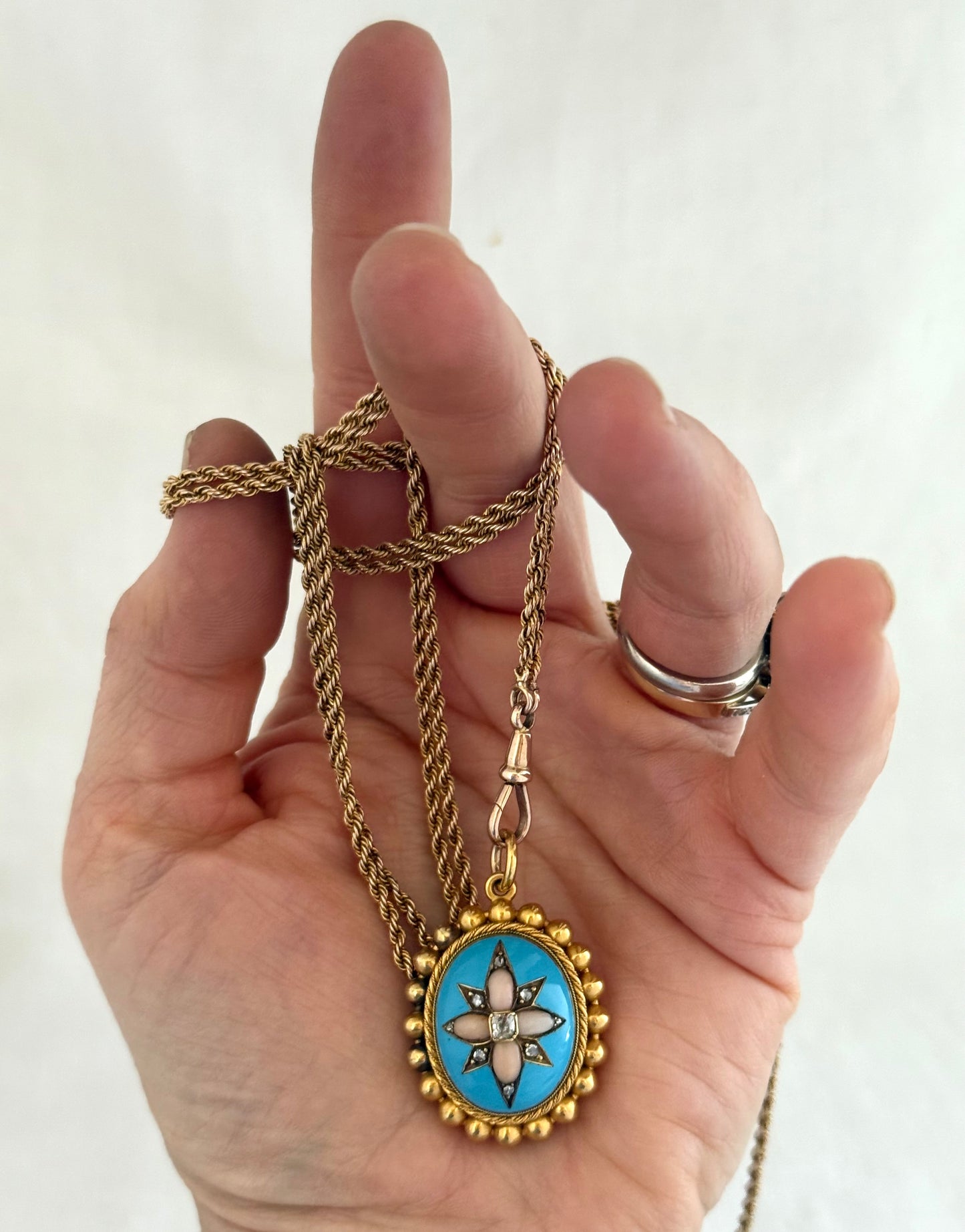 .15ct .1850s .1860s antique Victorian Yellow Gold Cushion cut Diamond Rose Cut Diamond star starburst Angel Coral and Blue Enamel Etruscan Revival Beaded border Mourning locket pendant